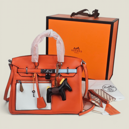 ​Sac Hermès Birkin Orange & Blanc : L'alliance parfaite du luxe et de la modernité.